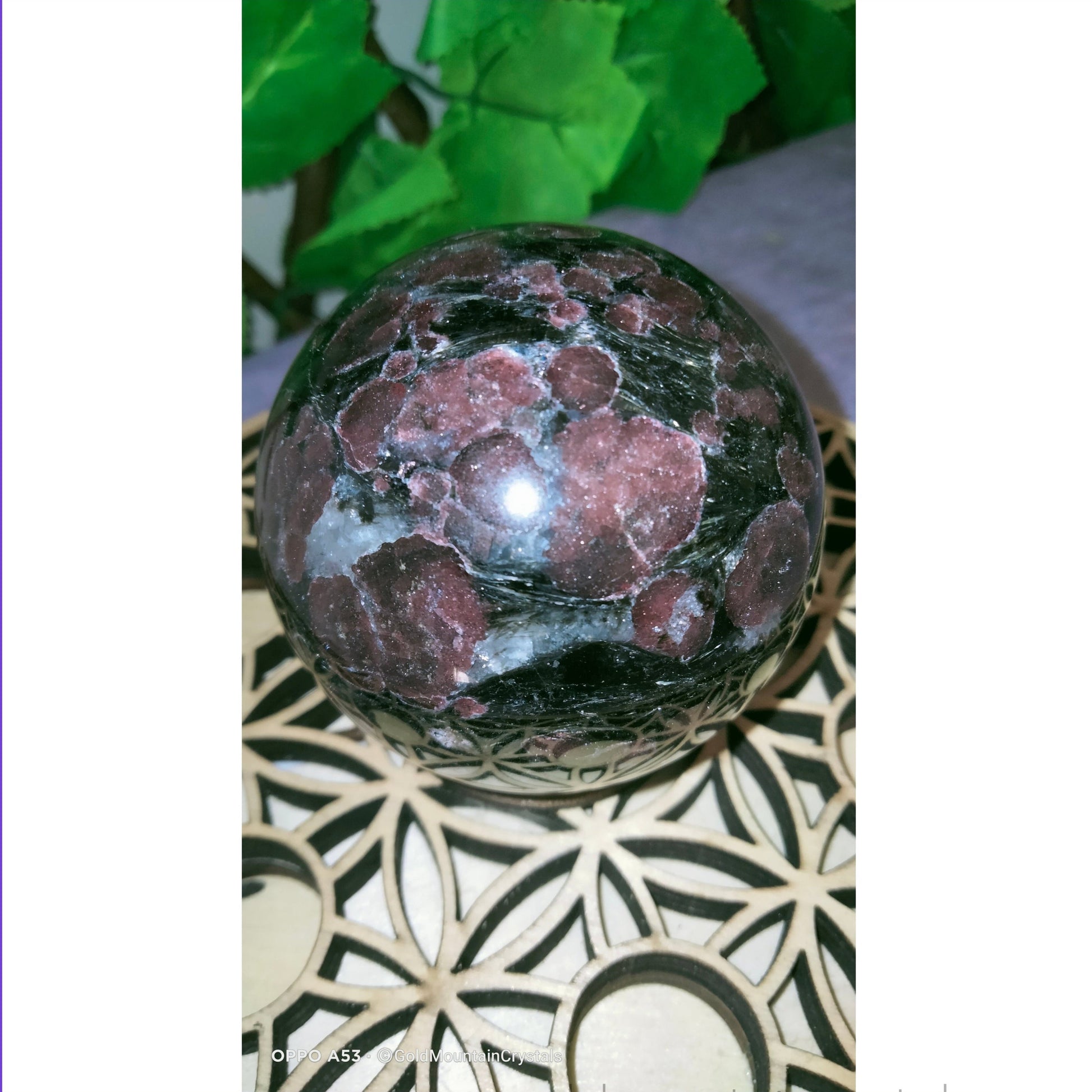 Garnet on astrophyllite sphere gold flash